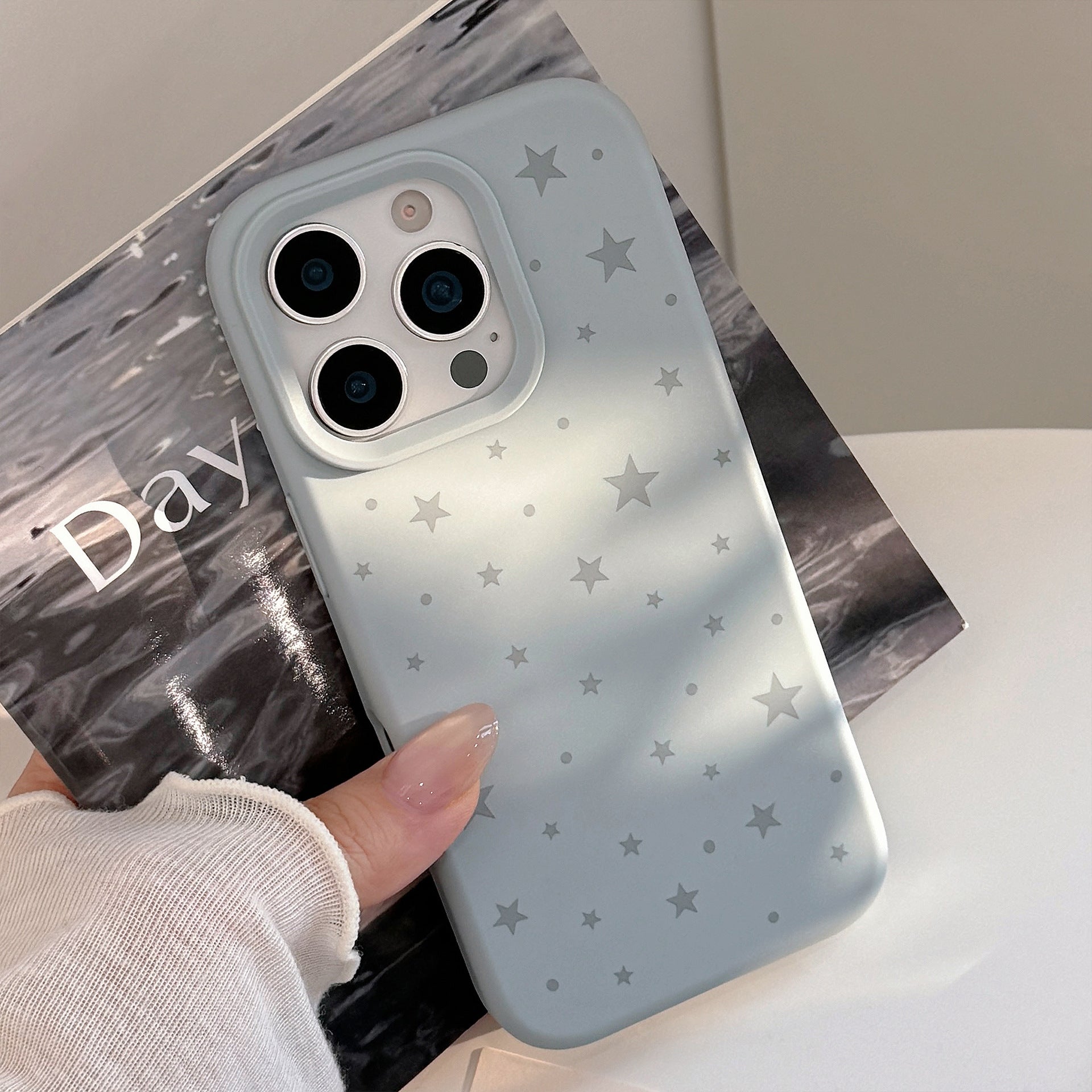 Minimalistisch gestaltete graue Star-Silikon-Handyhülle
